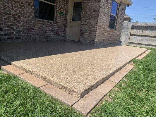 Saddle tan full broadcast in an outdoor patio