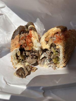 Cheese steak on sesame roll