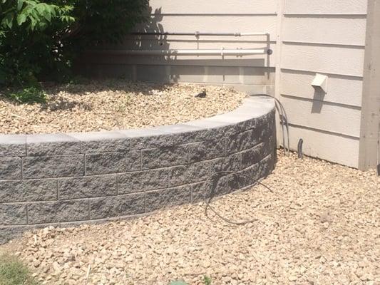 This retaining wall replaced an old crumbling wall.  It creates a nice raised planter.