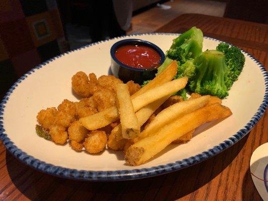 Popcorn Shrimp with a few fries and some broccoli (half of a kids meal)