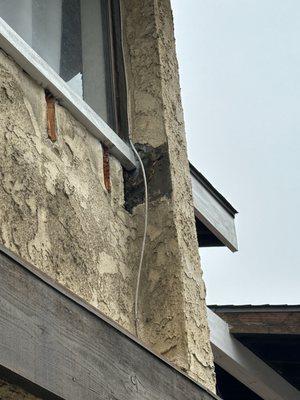 Additional stucco damage.