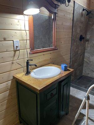 Installed a vanity and renovated the shower and floor.