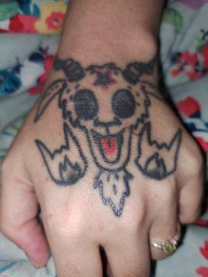 Funky, goofy hand tat by Damen