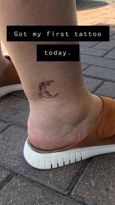 Crescent moon tattoo.