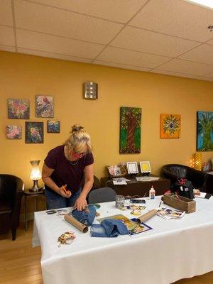 Artist and teacher, Elisa Waller, creating during Open Studio