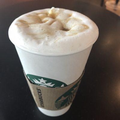 Caramel macchiato with whipped cream and caramel drizzle