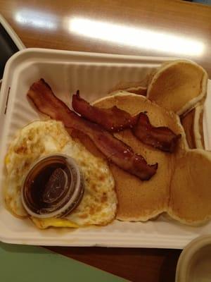 Mickey Mouse pancakes with eggs and bacon