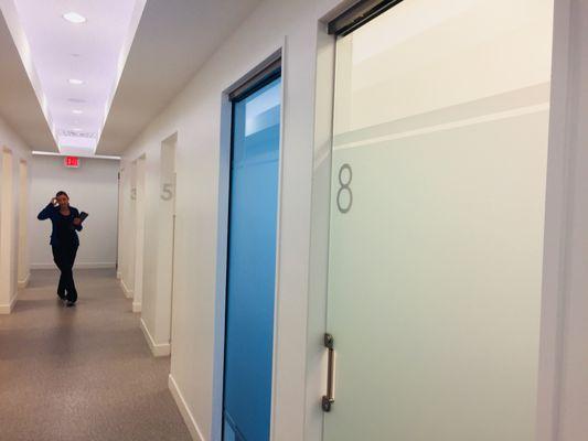 Frosted vinyl panels with opaque numerals, and dimensional silver room numbers create a clean, modern look for this office.