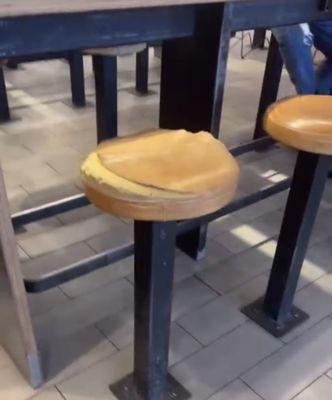 Have a seat on this disgusting torn stool. No? Me either.