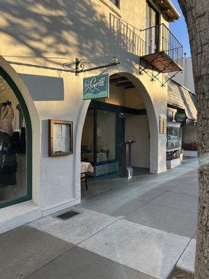 Come dine behind the arch of the first movie theater in Carmel by the sea at the historical Warren Building.