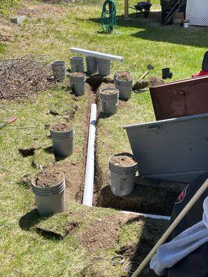 Drain installation in progress for waterproofing system