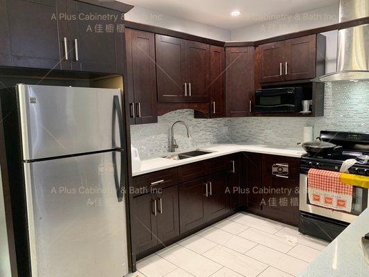 Espresso shaker cabinets with white sparkle countertop