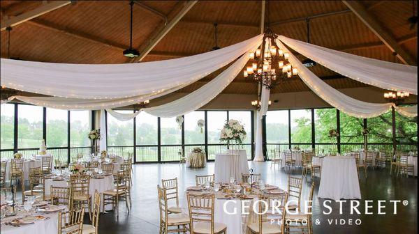 Ceiling drape by Party Belles and rented sequin table runners and gold chairs.