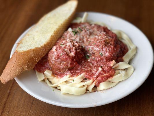 Fettuccine and Meatballs. Our meatballs are an old family recipe, which we make a roll in house.