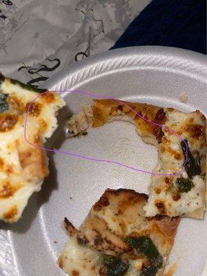 Pizza with hair baked in it