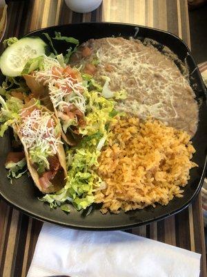 Two chicken tacos. Beans, rice and salad