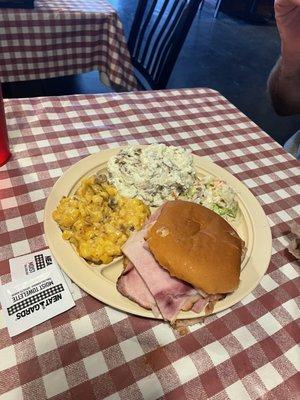 Ham sandwich with Burnt - End Cheesy Corn, potato salad and Coleslaw