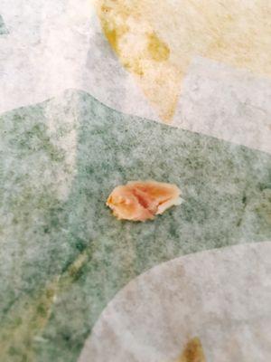 The tiny piece of bone I found in my sandwich. I spit the other piece out with my bite. Didn't want to post.