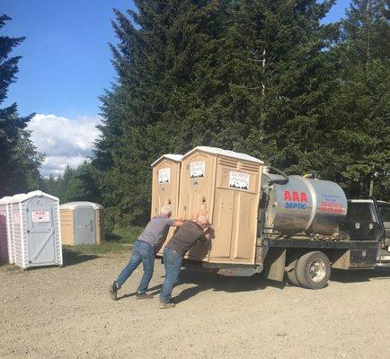 Loading up some of our standard portable restrooms.