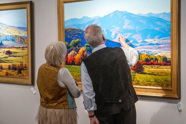 Viewers admire Douglas Aagard's newest paintings