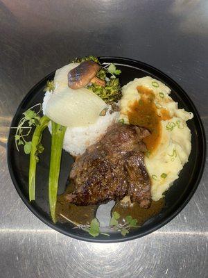 Domestic Imperial Wagyu Beef braised for 6 hours, garlic confit mashed potatoes, side of vegetables, and white rice.