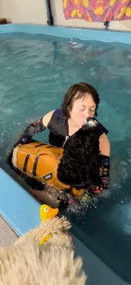 Theo kissing Kathy after a wonderful Swim Therapy session.