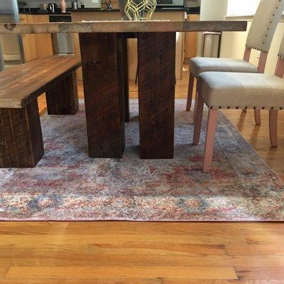 Custom table and pink chairs Rider Design Group designed, commissioned, and oversaw for an on time install!