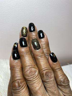 Gel nails with stickers added, nails done by Morelia. She's fantastic and attentive to detail!