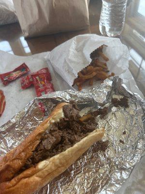 "Philly Cheese Steak Sub and Fries"