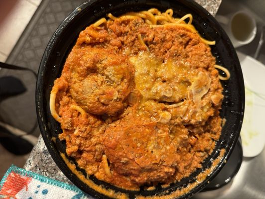 Fried zucchini and pasta bolognese with meatballs. Delicious meal