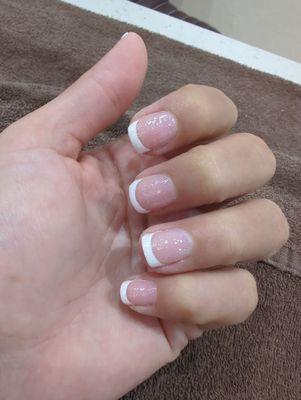 A regular French manicure with a little glitter