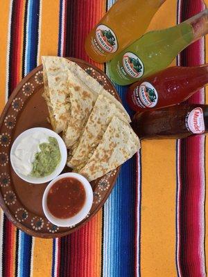 Chicken Quesadillas on Flour tortilla with side of guacamole, sour cream , salsa