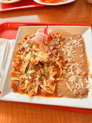 Chilaquiles plate. Big portion. I added the veggies on top from the salsa bar.