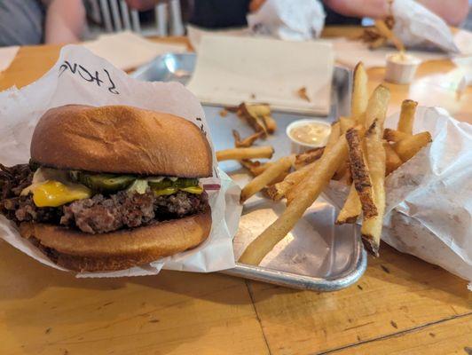 Single humble burger with cheese and all the fixings. Side of fries