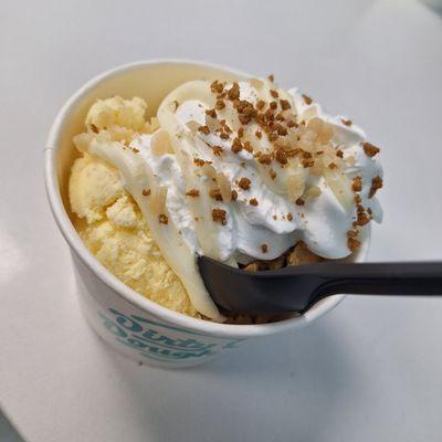 Dirty scoop: vanilla ice cream cup with choice of cookie topped with whipped creams, cream cheese and cookie crumbles