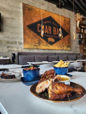 Half chicken, baked beans, truffle fries, and Half Brisket.