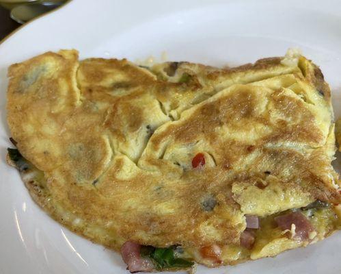 Ham, cheese, peppers onions, and mushroom omelet!  Perfection!