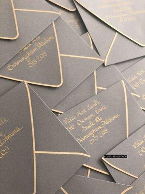 Wedding calligraphy; gold ink on slate envelopes