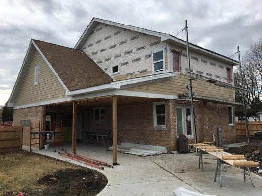 Completed roof, & partial James Hardie siding installation.