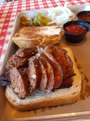 Brisket and jalapeno cheddar sausage sandwich