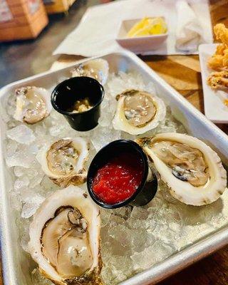 Raw Oysters on the half shell. Very good but very small