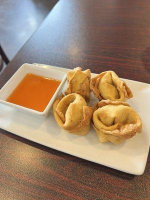 Handmade crab Rangoons (4) for appx $12. Sweet/spicy sauce. A little doughy where the folds were but over all yummy!