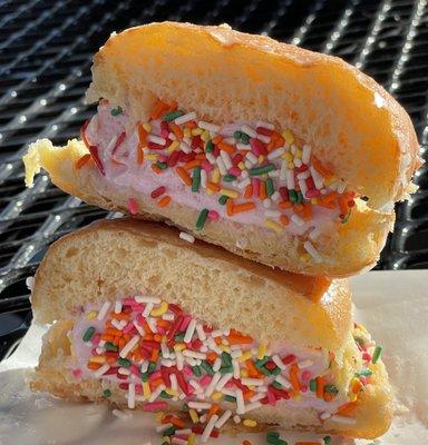 Strawberry Ice cream sandwich donut with sprinkle.