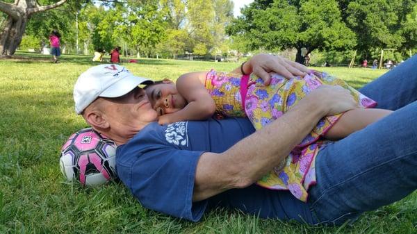 Attorney Jeffrey Milam, after a hard week in court, relaxes with little Faith Milam at a local park.