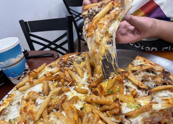 Cheese stake, fries, pasta and mozzarella sticks on a pizza!