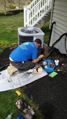 Installing new outdoor Carrier Condenser.