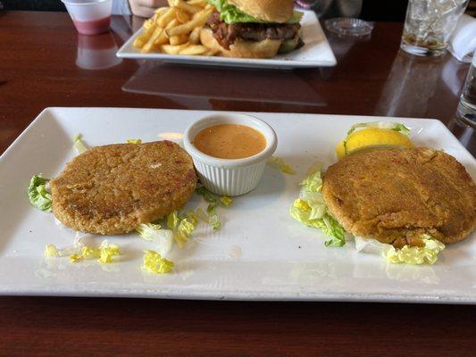 This is exactly how it was delivered to the table. Doesn't even look like crab cakes. Sad squashed patties with a pittance of lettuce.