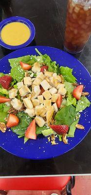 Strawberry grilled chicken salad with spinach and romaine. Served best with balsamic vinaigrette.