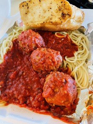 Spaghetti and meatballs with garlic bread dinner take out