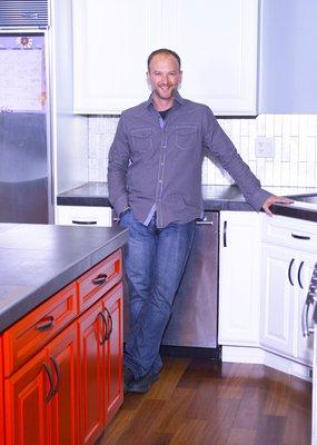 I love this kitchen! Red island, glass fool backsplash and Jeff!